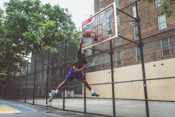 Basketball player training on a court in New york city Basketball player training on a court in New york city basketball player photos stock pictures, royalty-free photos & images