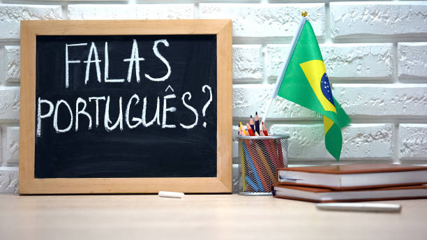 istock Do you speak Portuguese text on board, international flag in box, language 1169984749