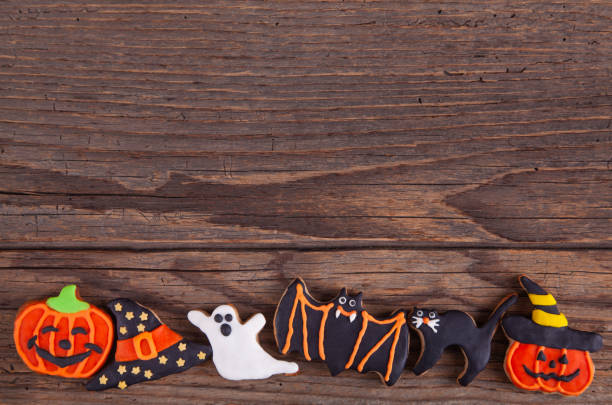 istock Halloween Homemade Gingerbread Cookies on rustic wooden table 1169988412