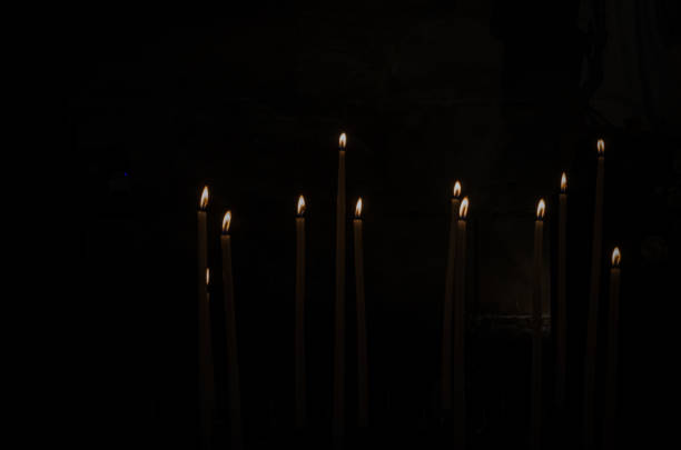 istock Flames of many burning candles 1169990326