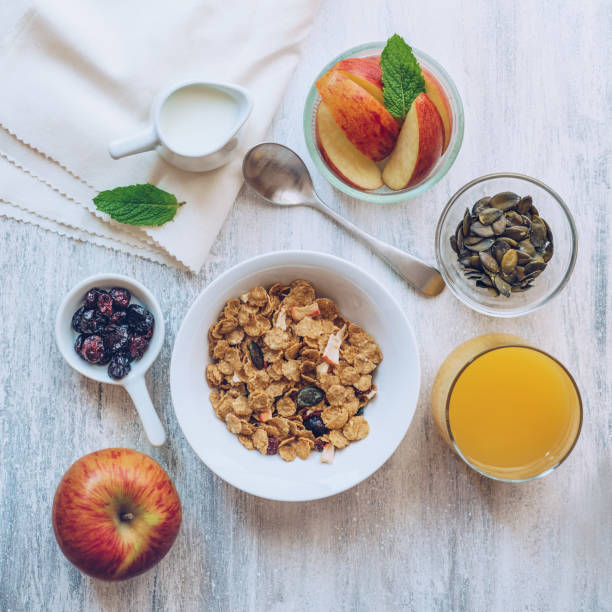 istock Bowl of breakfast cereal with fuits and milk 1169990401