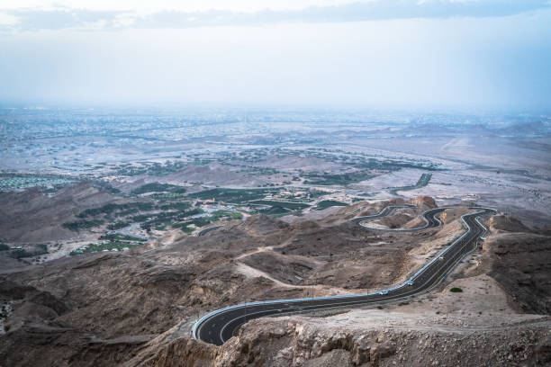 istock curvy road to jebal hafeet, uae 1169993122