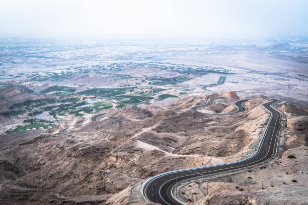 istock curvy road to jebal hafeet, uae 1169993125