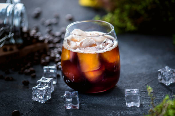 Ice coffee with ice cubes stock photo