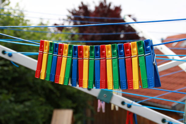 istock Close up of a colored clothespins on a clothesline 1169995464