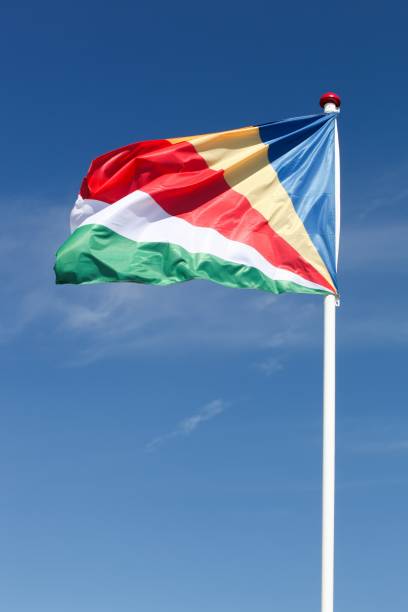 flag of seychelles waving in the sky - flag of seychelles imagens e fotografias de stock