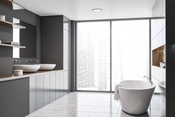 istock Panoramic gray bathroom interior, sink and tub 1169999063