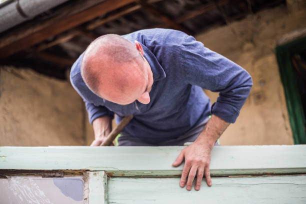 istock The master repairs the door 1170000901