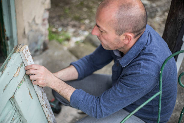 istock The master repairs the door 1170000946