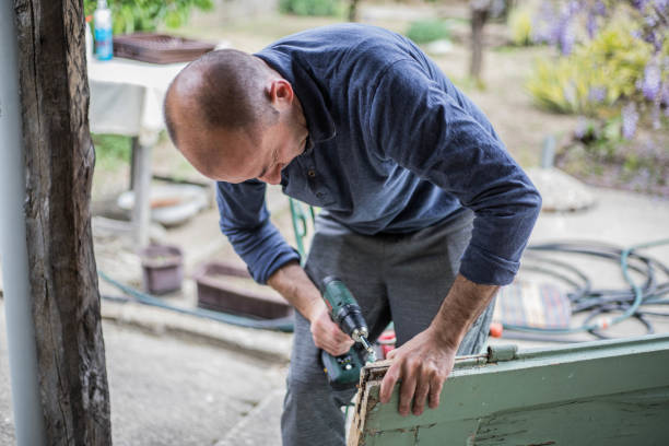 istock The master repairs the door 1170000965