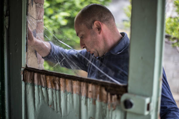 istock The master repairs the door 1170000974
