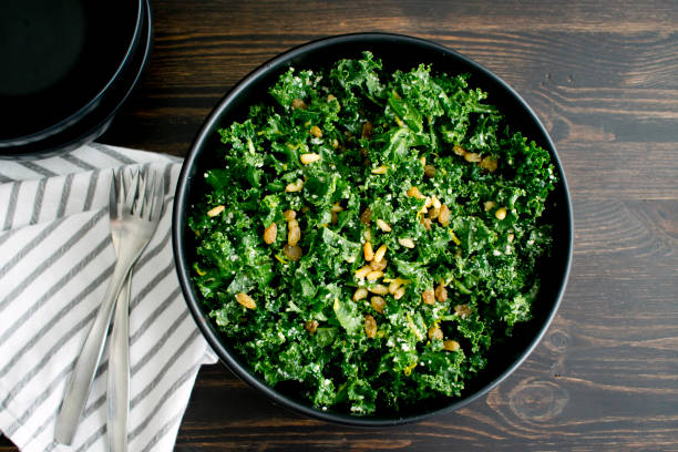 Kale Salad with Lemon Dressing A bowl of kale salad kale photos stock pictures, royalty-free photos & images