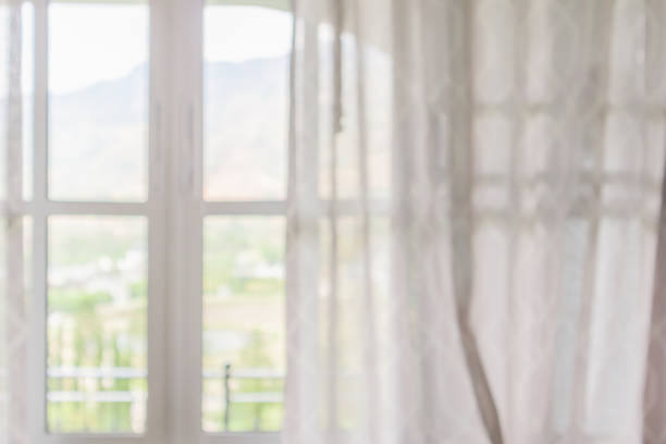 window curtain with green garden abstract blur background