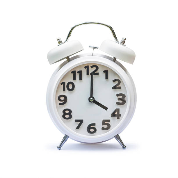 istock White alarm clock at 4 four o'clock isolated on white background (clipping path) 1170007540