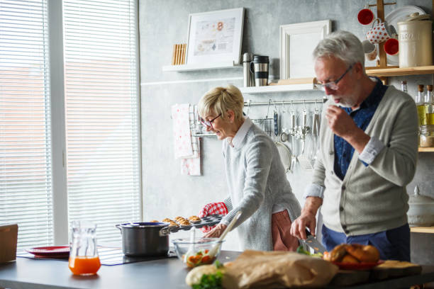 istock Senior couple cooking together 1170007551