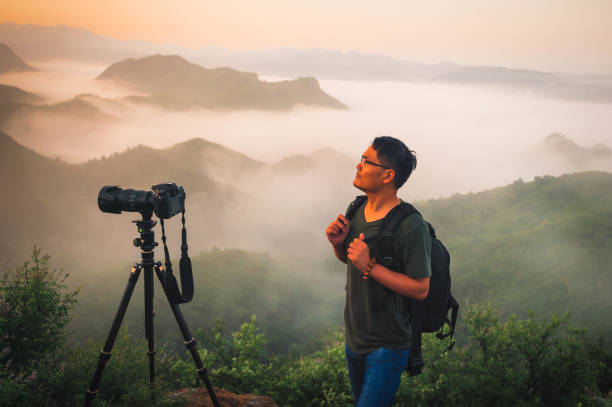 istock Professional photographer takes photos with camera on tripod 1170013819