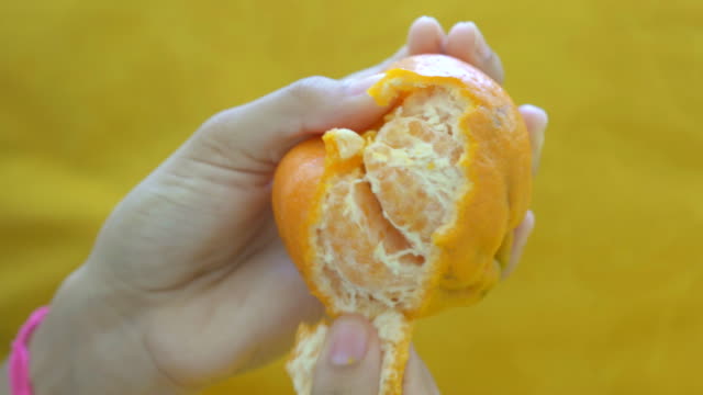 Peeling tangerine