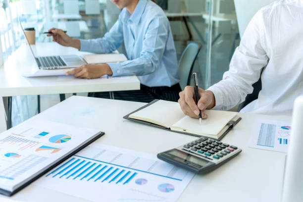 istock businessman in meeting analysis chart graphy 1170018681