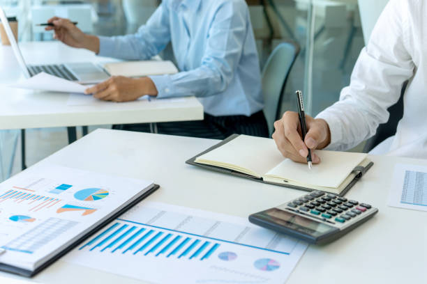 istock businessman in meeting analysis chart graphy 1170018685