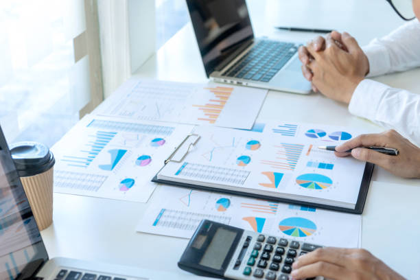 istock businessman in meeting analysis chart graphy 1170018687