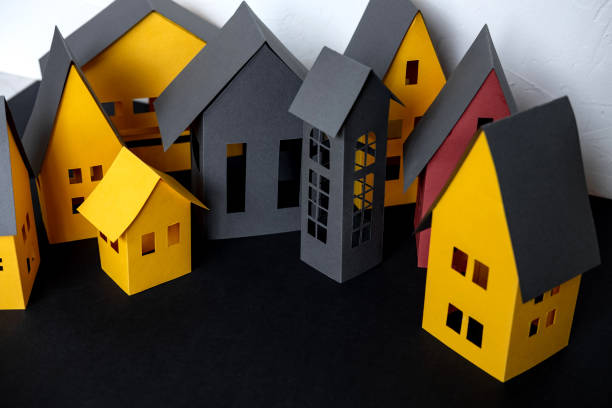 istock Paper City cut from a yellow paper on dark background 1170018892