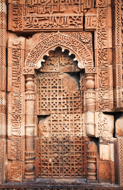 istock Qutub Minar - Ancient architecture featuring a carved wall Delhi 1170021136