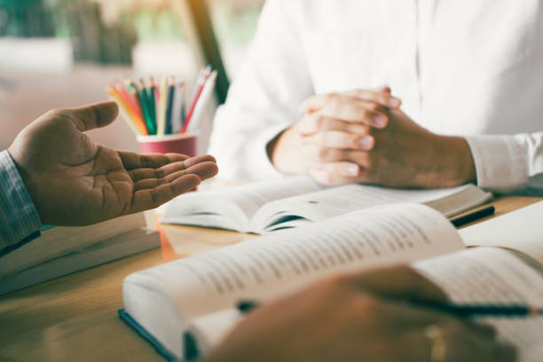 istock Teenager studying at desk and doing homeworks 1170022302