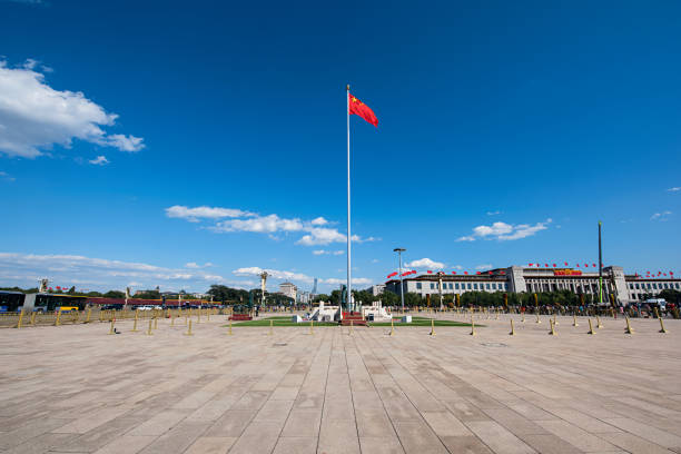 waving chinese national flag in tiananmen square - tiananmen square imagens e fotografias de stock