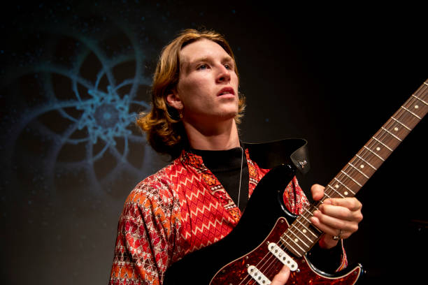 istock Young male performer plays his guitar with passion. 1170025917