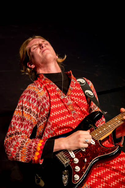 istock Young male performer plays his guitar with passion. 1170025933