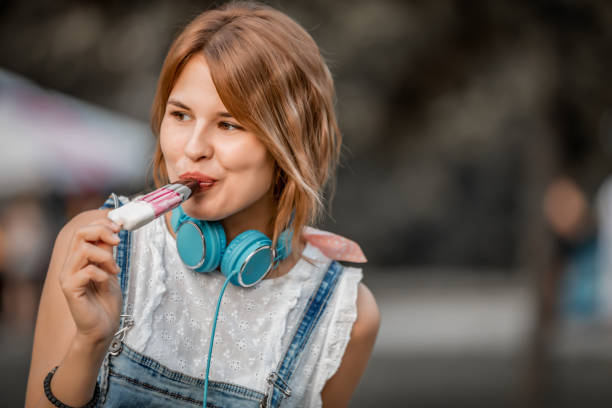 istock Blonde girl eating ice cream 1170031798