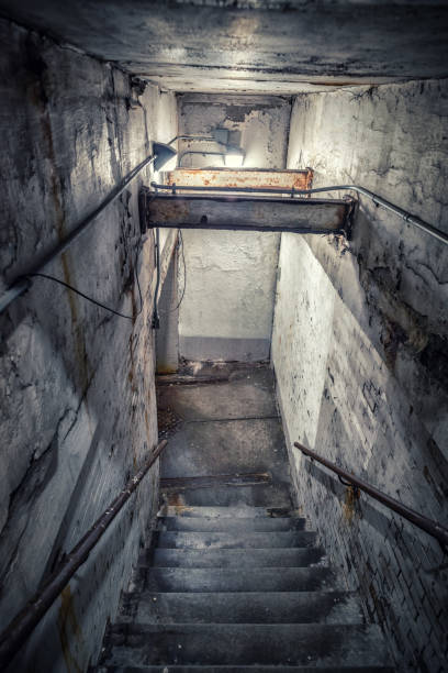 istock Scary stairwell leading down to a dark tunnel 1170032464