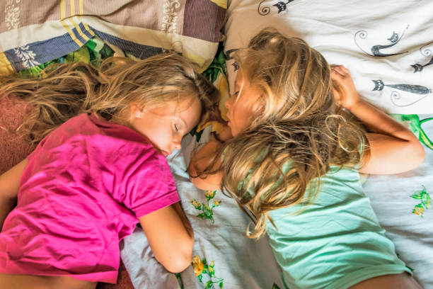 istock Two little girls  are sleeping 1170033340