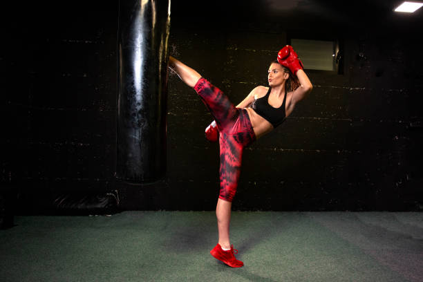 istock Strong woman with boxing gloves on hands exercise on gym 1170034884