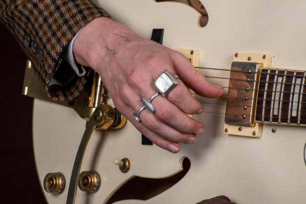 istock Young man practices with his electric guitar. 1170040615
