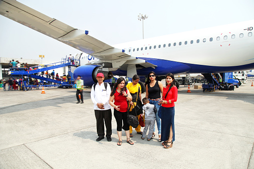 Family standing in front of passenger plane. An airliner is a type of aircraft for transporting passengers and air cargo. Such aircraft are most often operated by airlines. Although the definition of an airliner can vary from country to country, an airliner is typically defined as an aeroplane intended for carrying multiple passengers or cargo in commercial service.