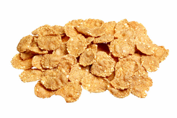 istock Pile of Corn Flakes from low perspective isolated on white. 1170043518