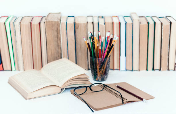 istock education concept background, many books piles with copy space for text 1170047544