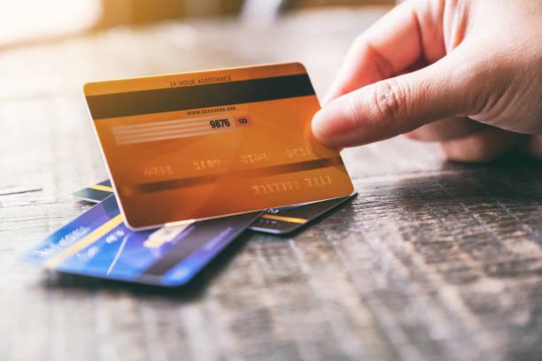 istock a hand holding credit card 1170047559