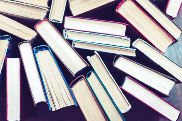 istock education concept background, many books piles with copy space for text 1170047573