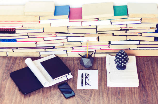 istock education concept background, many books piles with copy space for text 1170047726