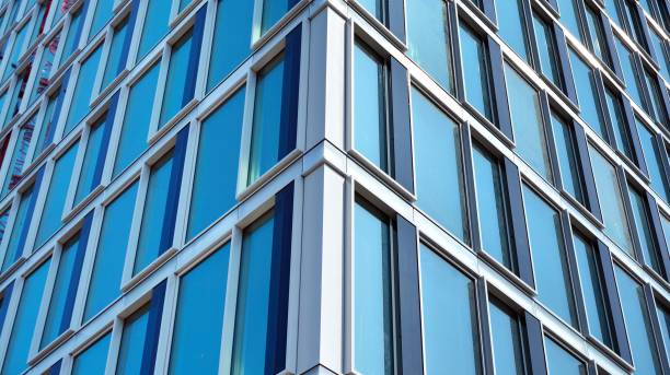istock Modern office building with reflection in windows of building 1170058181