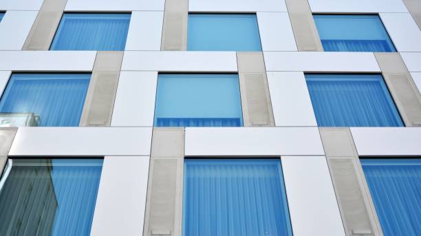 istock Modern office building with reflection in windows of building 1170058372
