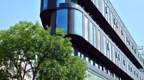 istock Modern office building with reflection in windows of building 1170058659