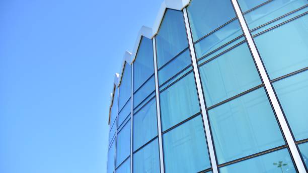 istock Modern office building with reflection in windows of building 1170058941