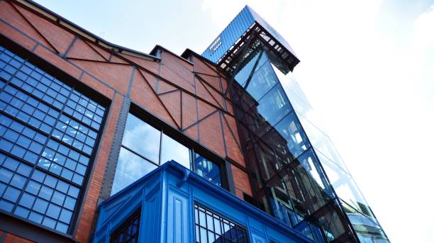 istock Revitalized red brick building and modern office building. 1170062456