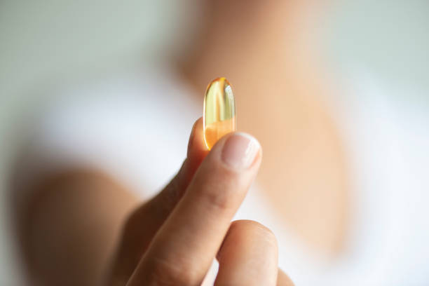 istock Woman with Soft Gel Capsule 1170062496