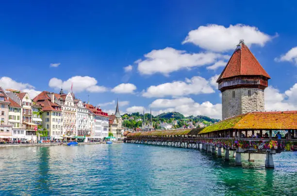 Lucerne, Switzerland. Chapel Bridge and Water Tower is a covered wooden footbridge across the Reuss River in city Lucerne in central Switzerland.