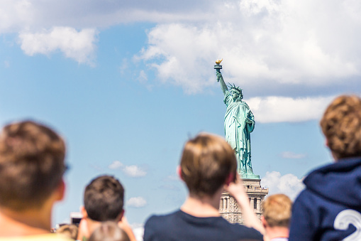 People make photo of the Statue of Liberty in New York City, NY, USA
