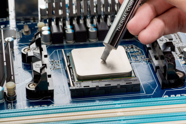 istock close up of Silicone CPU or Thermal Compound on Mainboard Electronic computer. 1170065665